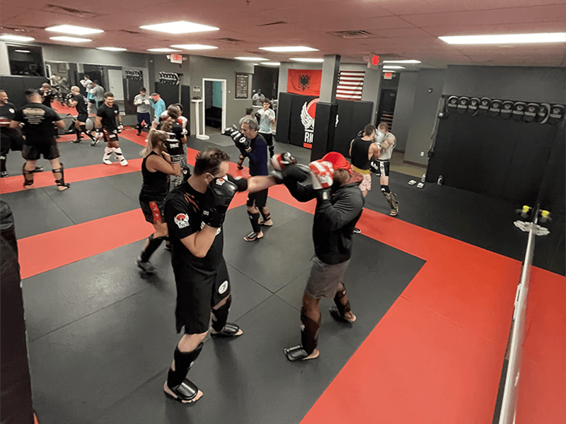 Rigoro teen and adult kickboxing class practicing combinations