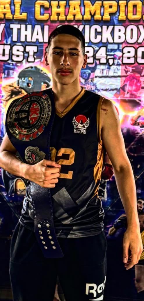 Eron Buxha holding a WKA championship belt