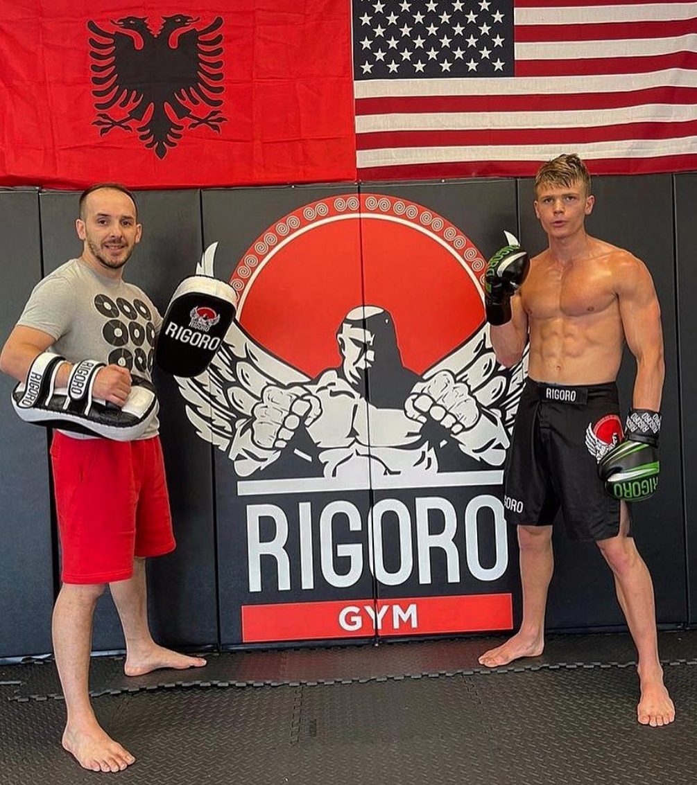 Rigoro coaches and athlete at the gym