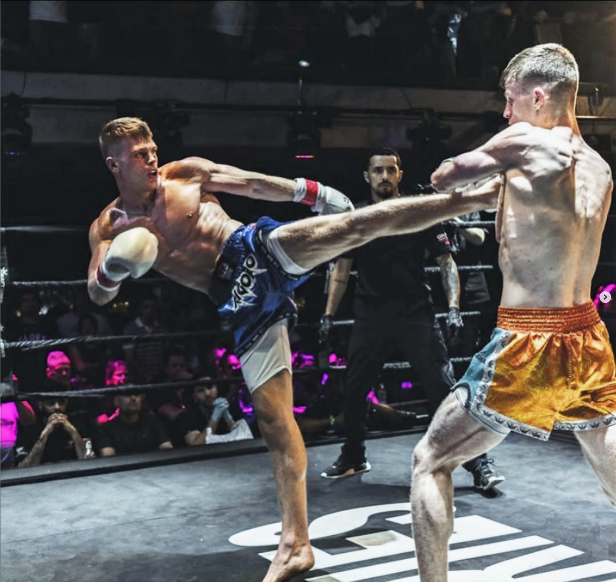 Rigoro athletes exchanging strikes during competition