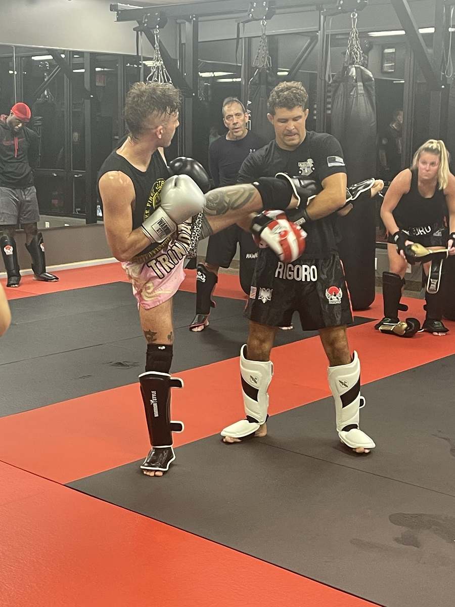 Rigoro members practicing kickboxing combinations
